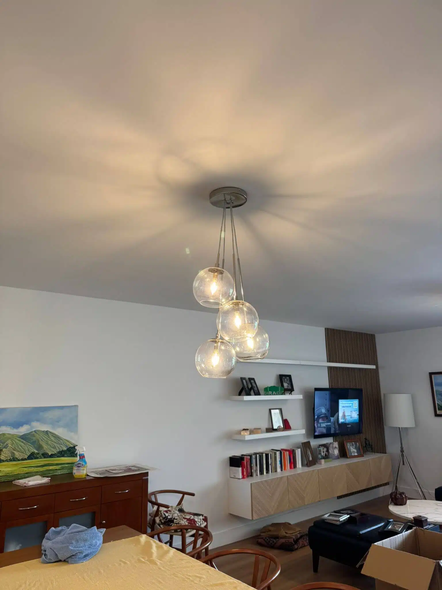 Flush-mounted ceiling light fixture installed in a modern residential living space – electrical lighting upgrade.