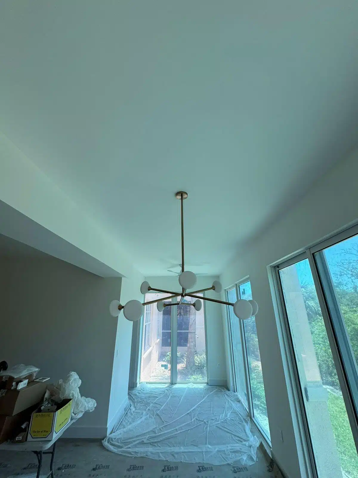 Recessed LED ceiling lights installed in a remodeled living room – energy-efficient residential lighting service.