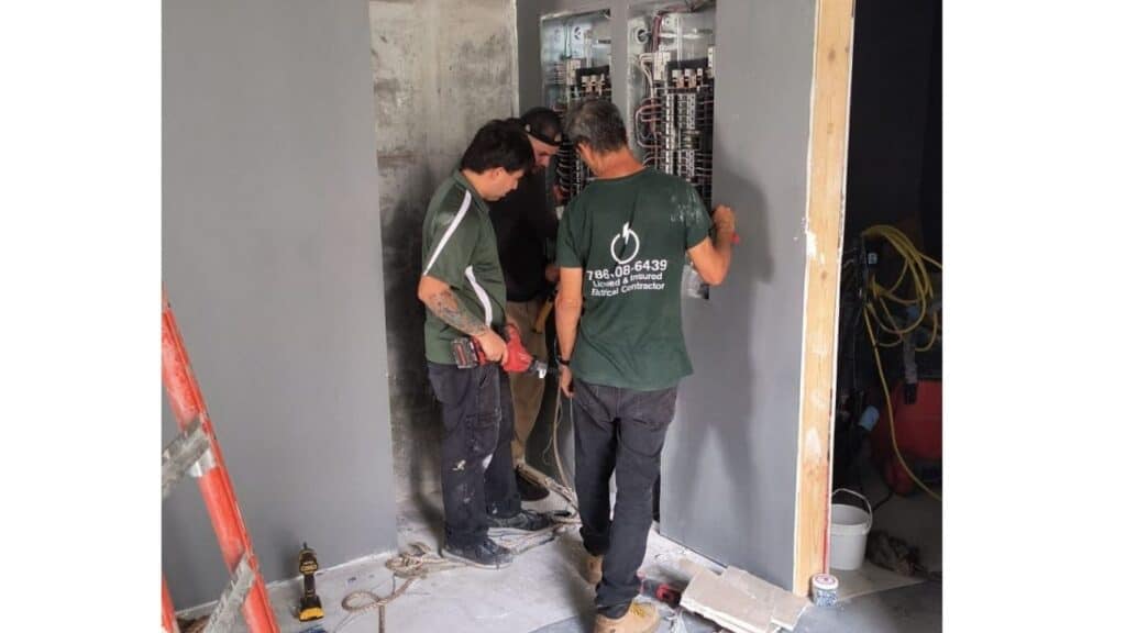 Licensed and insured electrical contractors from XPE wiring main circuit breaker panels in a commercial renovation project.