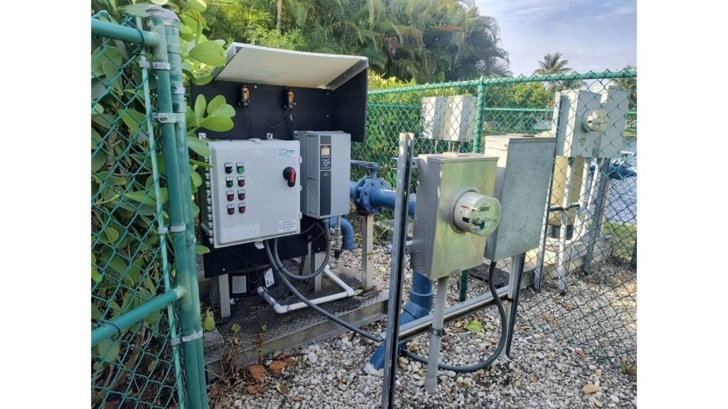 Outdoor industrial pump control panel with variable frequency drive (VFD) and electrical meter installation.