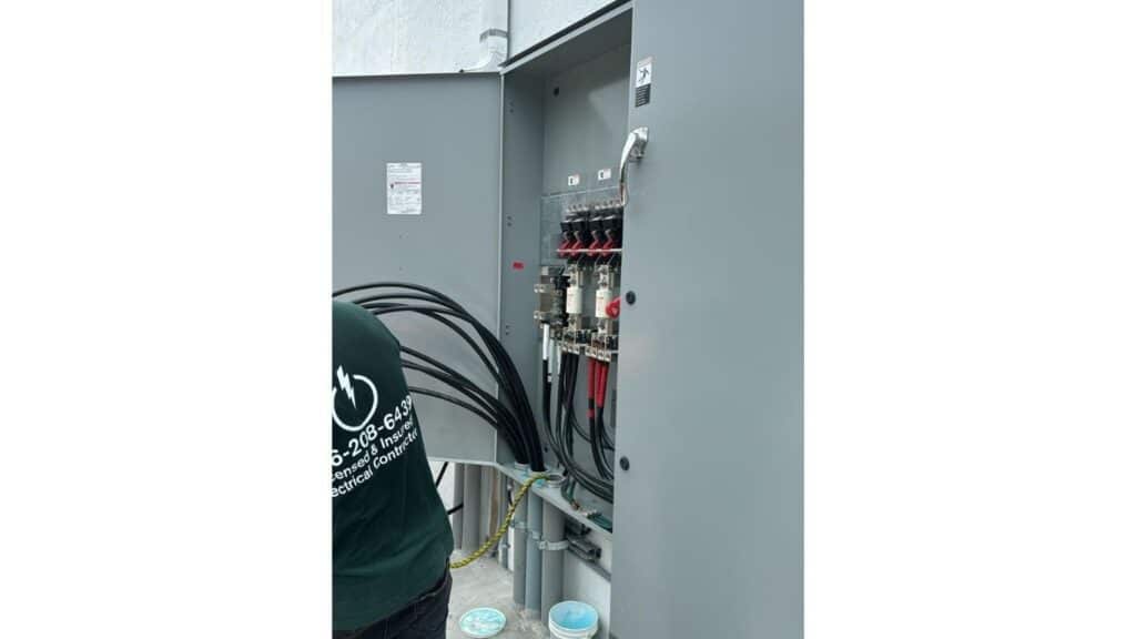 Temporary electrical power pole and meter socket installation for a residential construction site.